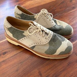 Dr. Martens Dillan brogue saddle shoes in a beige and green camouflage